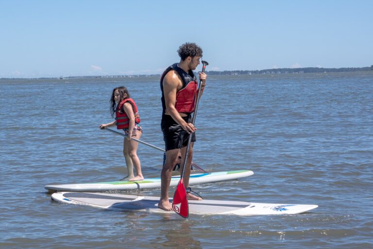 two people on surf boards in the water