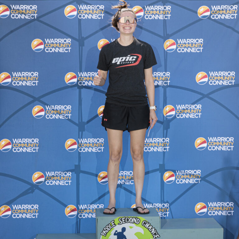 a woman standing on top of a podium