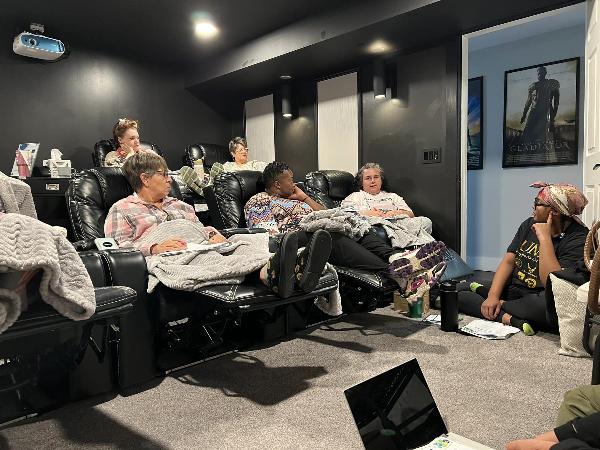 a group of people sitting in a room