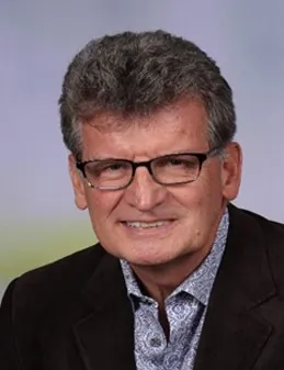 a close up of a person wearing glasses